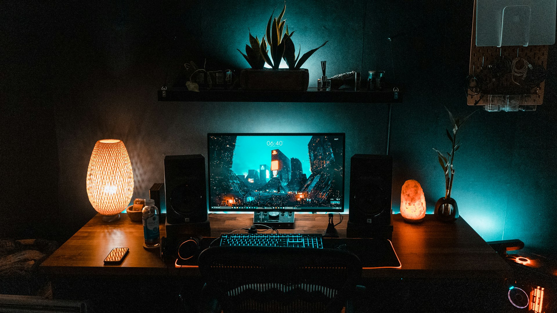 A player crouched at a glowing battlestation surrounded by crystal-blue light